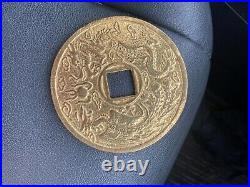 Chinese gold face sized coin Chinese words and Chinese animals on it