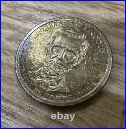 Rare TONED Collectible Abraham Lincoln Presidential 1$ Gold Dollar Coin