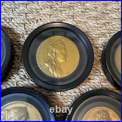 Rare cast relief gold european coin coaster set